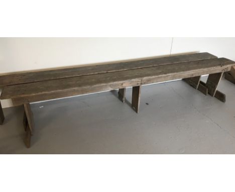 A vintage pair of long pine school benches. Vendor advises removed from Swaffham Convent school. Approx. 250cm long x H45cm.