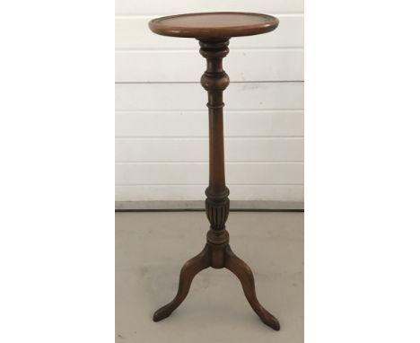 A vintage circular topped torchere with turned pedestal and tripod base.  Approx. 91cm tall.