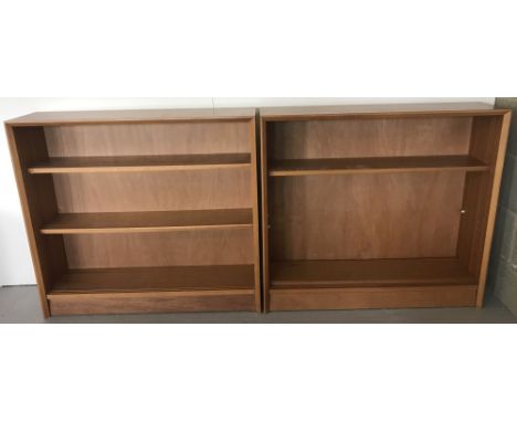 A pair of vintage teak bookcases each with 2 adjustable shelves.  Each one approx. 92cm x 84cm.