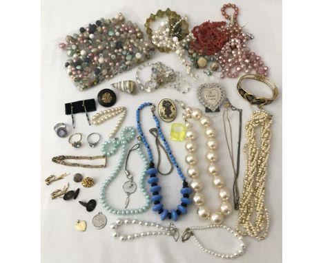 A collection of vintage costume jewellery and vintage beads. To include necklaces and aurora borealis glass beads. 