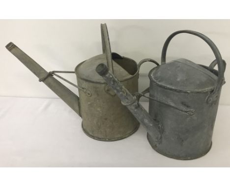 2 vintage galvanised 1 gallon watering cans.  Each one approx. 31cm tall.