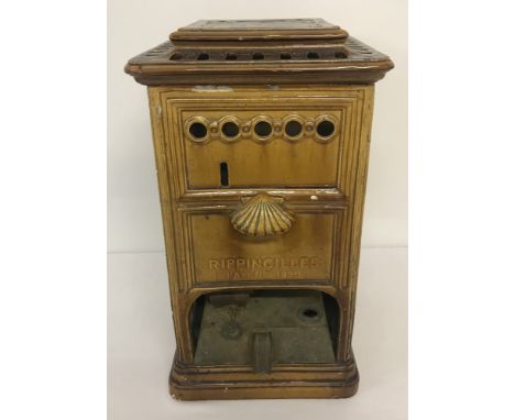 A small Rippingilles enamel stove.  Marked Patent 1890. Amber coloured, with scallop detail to front and rear, and fleur de l