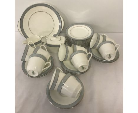 A quantity of Royal Doulton first quality Tea ware in "Etude" pattern H5003. Comprising: Sandwich/cake plate, 12 cake plates,