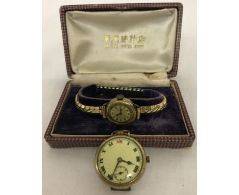A vintage ladies rolled gold case wristwatch. Expanding rolled gold and stainless steel strap. Together with a vintage gentle