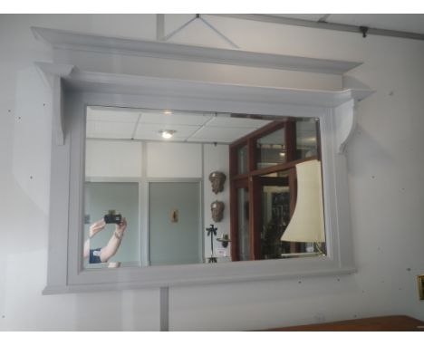 AN ARTS AND CRAFTS STYLE OVERMANTLE MIRROR with shelf and broad cornice, painted white, 116cm wide 