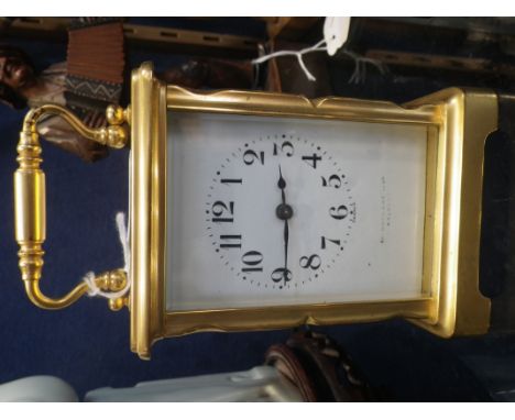 AN EDWARDIAN BRASS CASED CARRIAGE CLOCK  