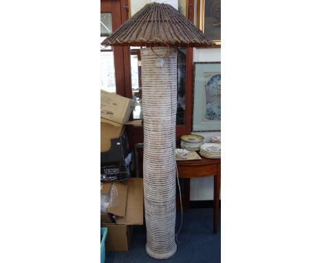 A VINTAGE POTTERY STANDARD LAMP in the form of a palm tree, with 'stick' woven shade, 178cm high (overall) 