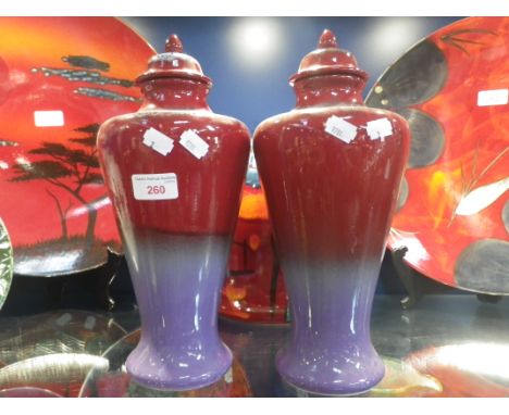 POOLE POTTERY; A PAIR OF RUSKIN URN VASES with covers, 33cm high (overall) 