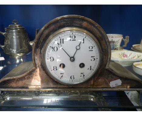 AN EDWARDIAN SILVER PLATED MANTEL CLOCK with white enamel face, 32.5cm wide 