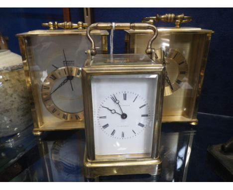 A BRASS CASED CARRIAGE CLOCK and two similar (3) 