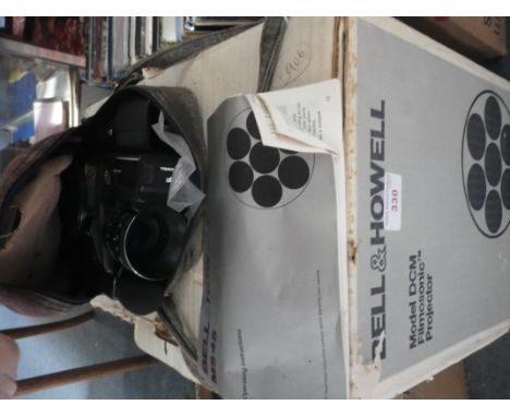 A BELL &amp; HOWELL FILMOSONIC PROJECTOR (boxed) and a video camera (2) 