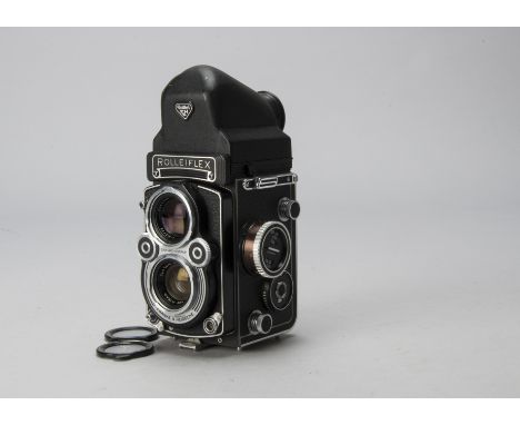 A Rolleiflex 3.5 F TLR Camera, serial no. 2819021, black, model 3, shutter working, body F-G, prism finder shows minor paint 