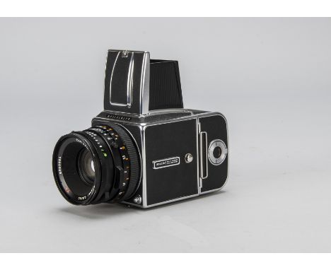 A Hasselblad 500C/M Camera, serial no. RI1291108, 1984, chrome, shutter working, body G-VG, with a black Zeiss Planar T 80mm 
