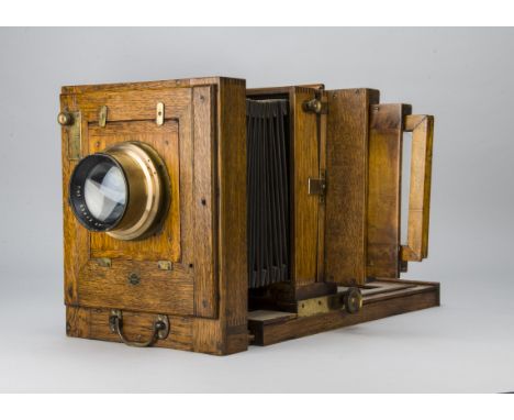 A Half-Plate Oak Repeating Back Studio Camera, oak, square bellows, tilt and swing repeating back, City Sales & Exchange Sale