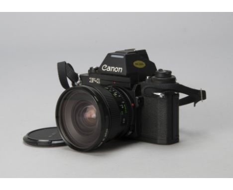 A Canon F-1 SLR Camera,  serial no. 209632, flat black finish, shutter working, body, G, minor brassing to prism, with Canon 