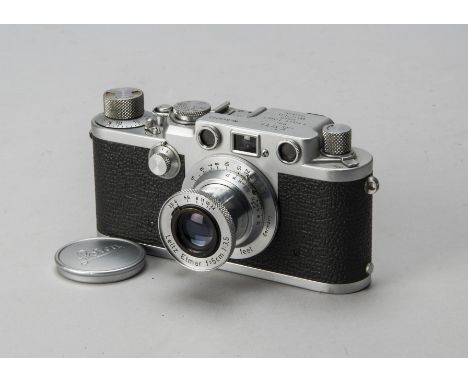 A Leica IIIf Red Dial Camera, serial no. 649731, chrome, 1953, shutter working, body, G, light marks to chrome and top plate 