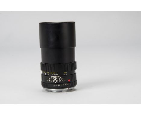 A Leitz Elmarit-R f/2.8 135mm Lens, serial no. 2192951, black, barrel G, some light marks to lens hood, elements VG, very min