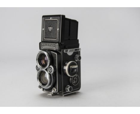 A Rolleiflex 2.8 F TLR Camera, serial no. 2411112, black, shutter working, body, G, light marks to paintwork, with Carl Zeiss