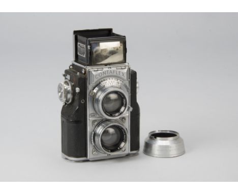 A Zeiss Contaflex TLR Camera, serial no. Y84352, chrome, shutter working, meter responding, body F-G, small patch of vulcanit