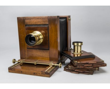 A Whole-Plate Studio Camera,  mahogany and brass, tilt and swing back, circa 1910, with adapted Houghton Victo ground glass f