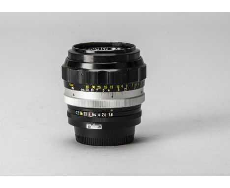 A Nikon Nikkor-H Auto 85mm f/1.8 Lens, AI, serial no. 194124, black, barrel G, minor surface dirt and mildew marks around rea