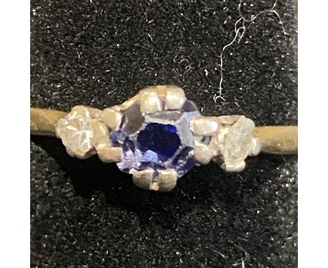 9ct gold sapphire and diamond ring. Central sapphire approx 0.30 CT, flanked by two small diamonds. Total weight 2.1gm. Size 