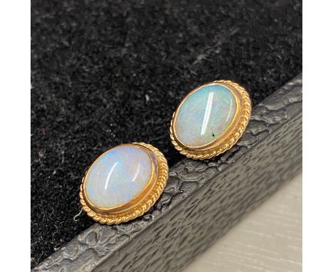 Pair of Australian 14ct gold and Opal cufflinks Hallmarked 585, weight 4.11 grams approx. Whale back closure. Approx 1.0 x 0.