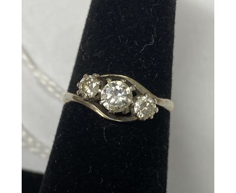 A 18ct gold and diamond trilogy ring Central diamond approximate weight 0.40 carat. Flanking diamonds 0.15 carat approximate 