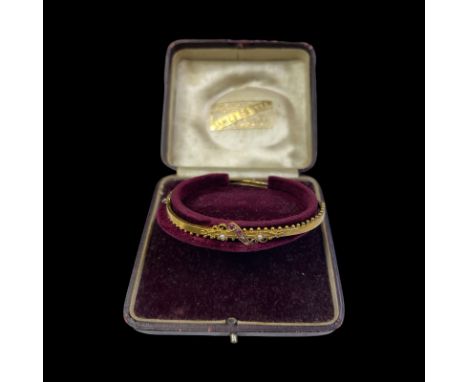 Victorian 15ct bracelet, featuring a scroll front with diamonds, rubies and seed pearls. In original box, retailer James Dowe