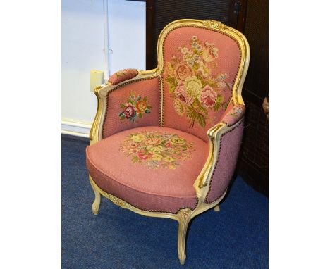 A French tapestry armchair, decorated with needlepoint foliate panels on pink upholstery, 80cm high x 62cm wide