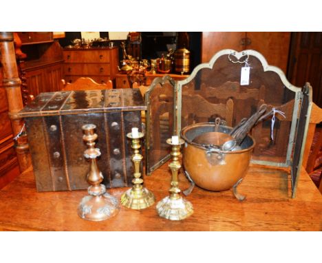 A quantity of copper and brasswares, to include copper graduated pots, firescreen, candlesticks and coal box etc