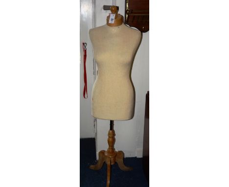 A vintage tailors dummy, raised on turned wood column and tripod supports, 146cm high