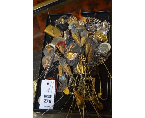 A quantity of vintage hat pins and collectables, to include various buckles, portrait miniature inserts etc
