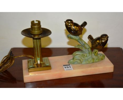 An Art Deco gilt metal and onyx desk lamp, decorated with two birds on branch, candlestick table lamp to opposite, raised on 