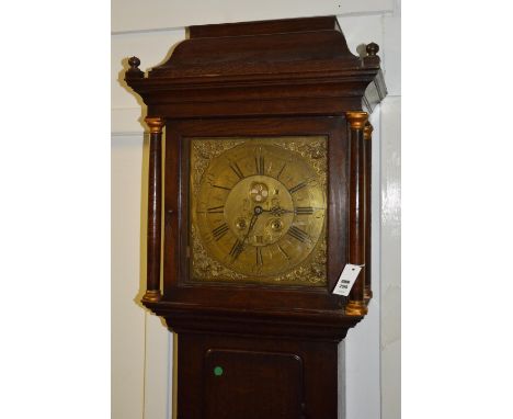 An early Georgian oak longcase clock by W Clark Kendal, with glazed swing door enclosing brass dial with date aperture, decor