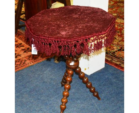 A Victorian mahogany gypsy table, the fabric covered octagonal top raised on bobbin supports, 65cm high x 60cm wide
