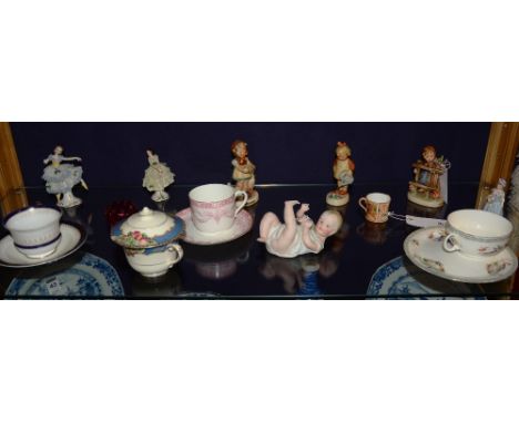 A quantity of decorative porcelain, to include bisque child figure, three Hummel figures, two small Dresden figurines, a mini