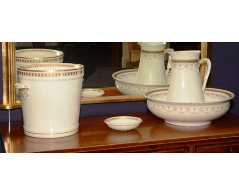 A Victorian pottery slop pail, with lid and gilded decoration, 29cm high, together with a Victorian toilet ewer and basin by 