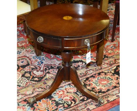 A modern circular revolving drum style occasional table, with fitted drawers and dummy drawers, raised on turned column and t