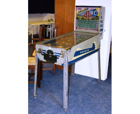 A vintage pinball machine by Bally Zephyr, circa 1930's, with box of old pennies, bagatelle shaped metal surface with playing