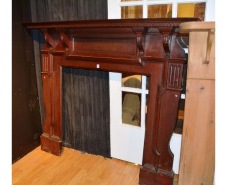 A carved fire surround in the Victorian style, with Greek key decoration to top, 140cm high x 165cm wide