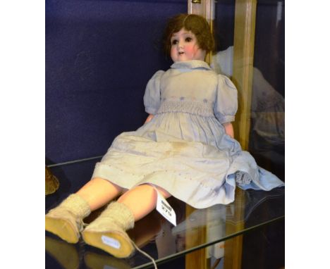 An early 20th century vintage bisque doll by Simon & Halbig, wearing traditional clothing, stamped to neck, 1909-3 Germany, 6