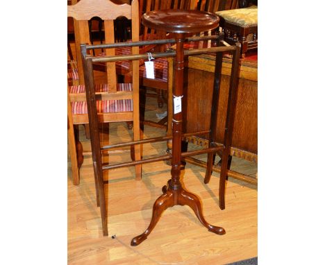 A mahogany plant stand, raised on tapering column and tripod supports, 105cm high, with a mahogany towel rail (2)