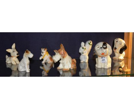 A quantity of ceramic dog figures, to include Crown Devon and Sylvac, also with a Plichta squirrel