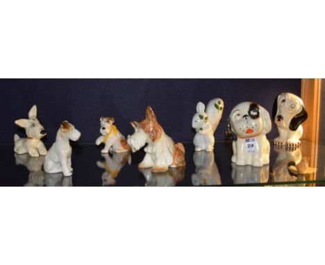 A quantity of ceramic dog figures, to include Crown Devon and Sylvac, also with a Plichta squirrel