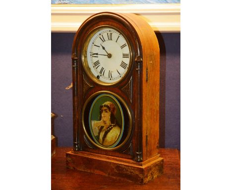 A Victorian American eight day regulator mantle clock, of domed shape, with glazed swing door, 45cm high