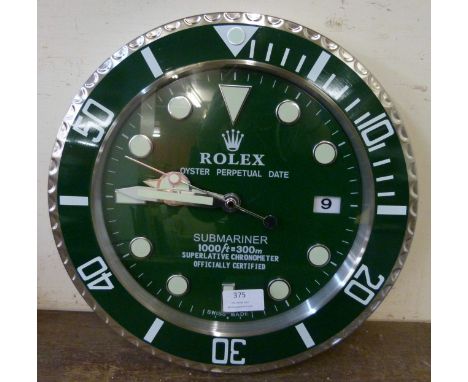 A Rolex style dealer's display wall clock 