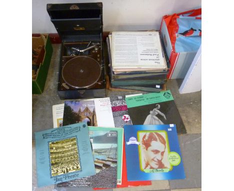 A vintage H.M.V. portable gramophone and assorted records 
