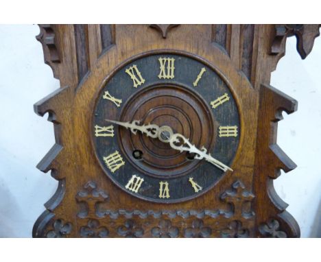 A late 19th Century carved oak cuckoo clock, a/f