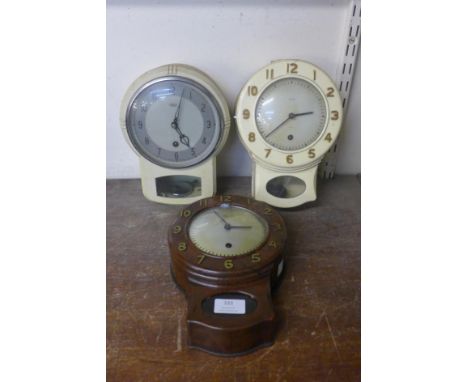 A vintage Smiths faux rosewood wall clock and two others 